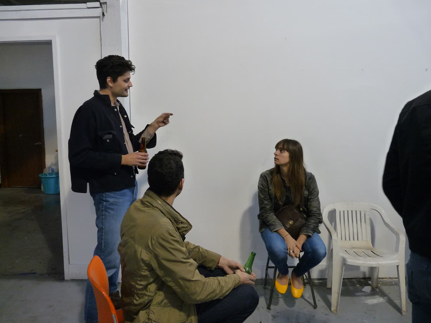 Detroit art community talking at an exhibition